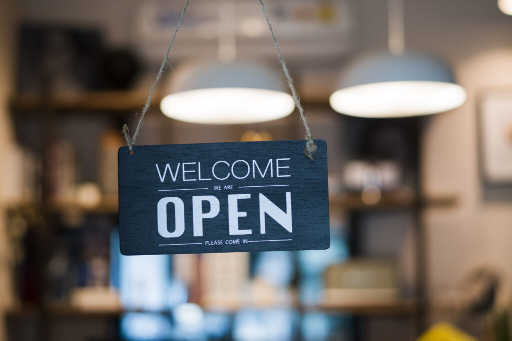 Store open sign hanging on the window