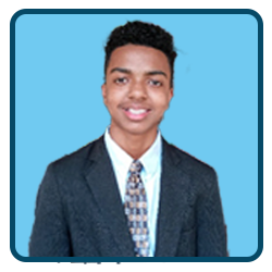 A young man in a suit and tie standing in front of a blue background.