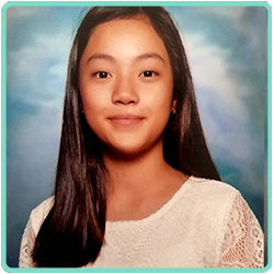 A photo of a young girl posing for a photo.