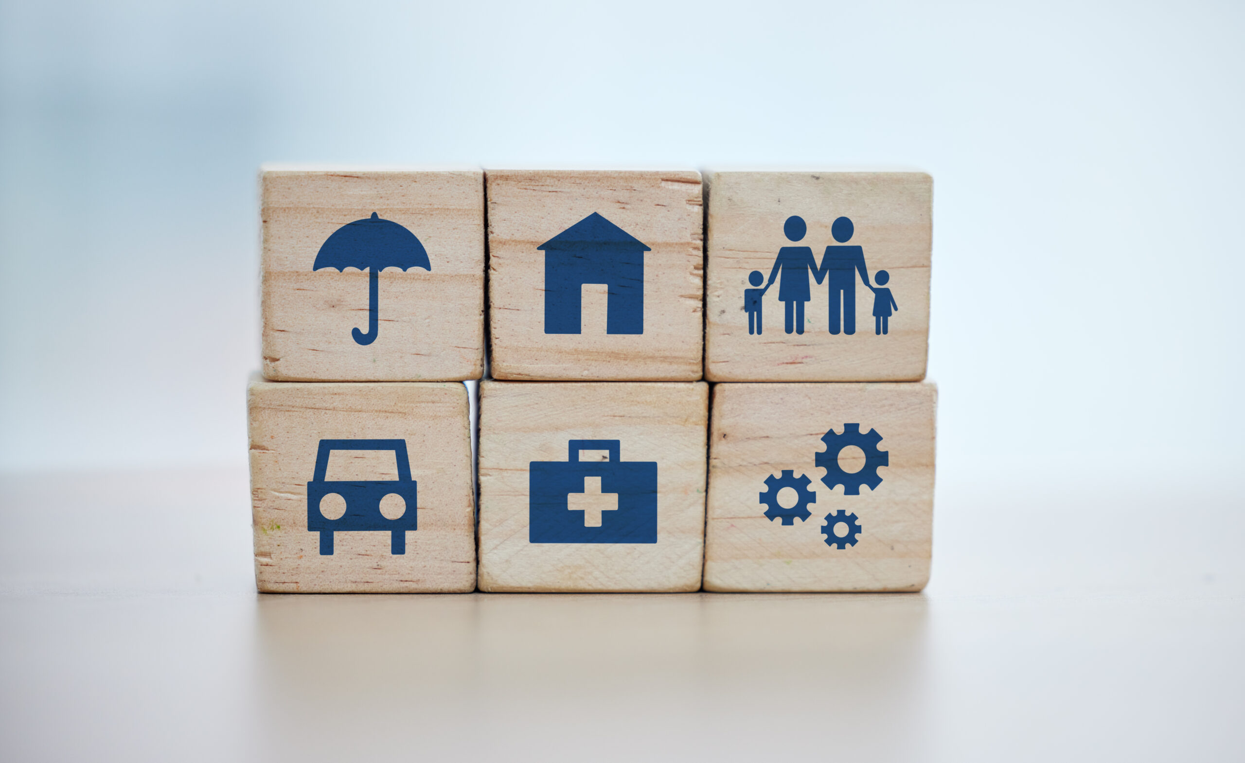 Wooden cubes stacked with logos on them.