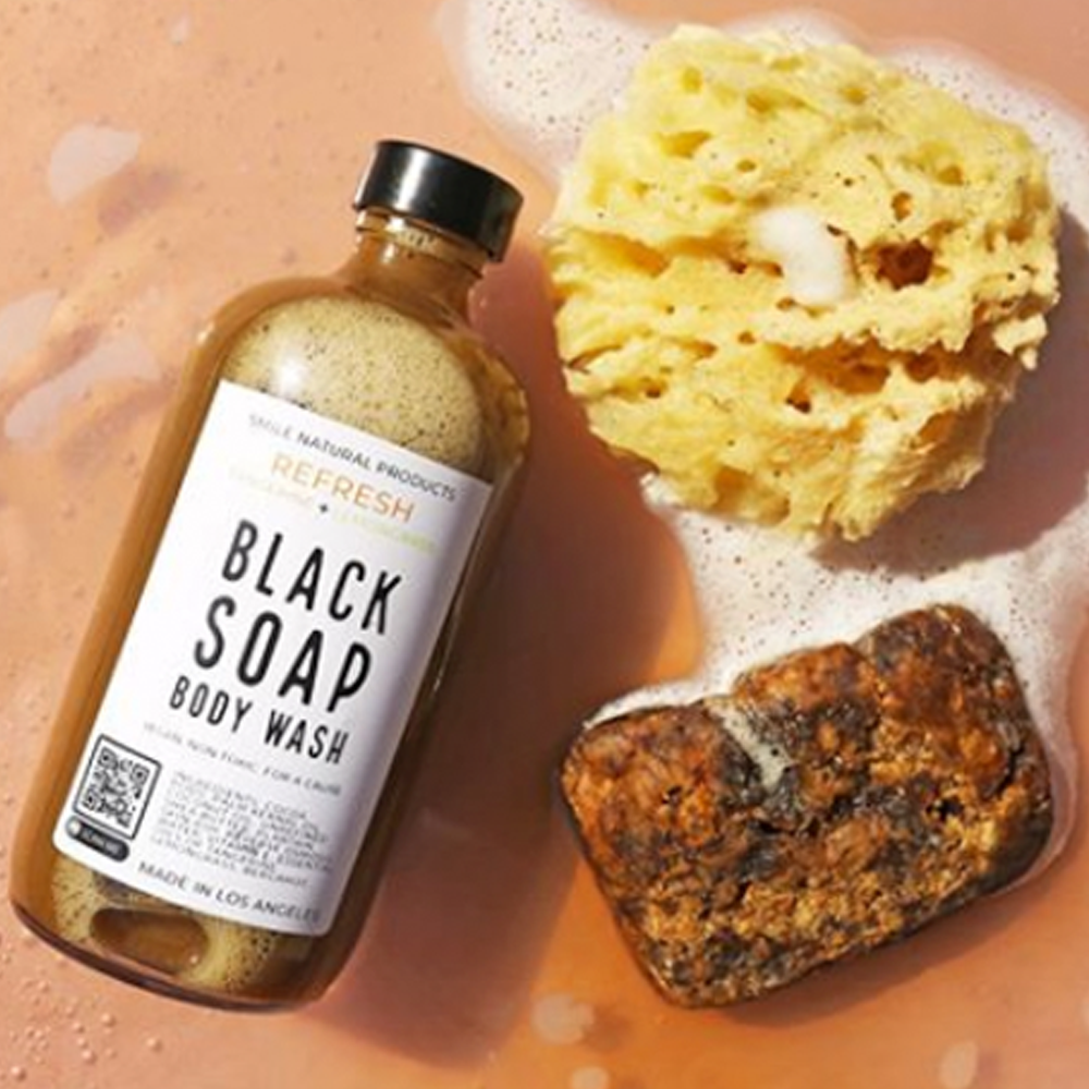 A bottle of black soap and a bar of soap.