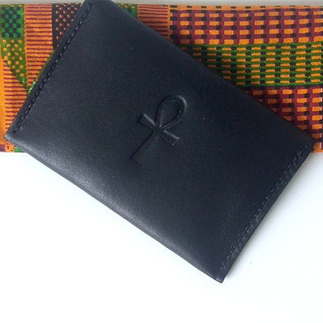 A black leather wallet with an ankh on it.