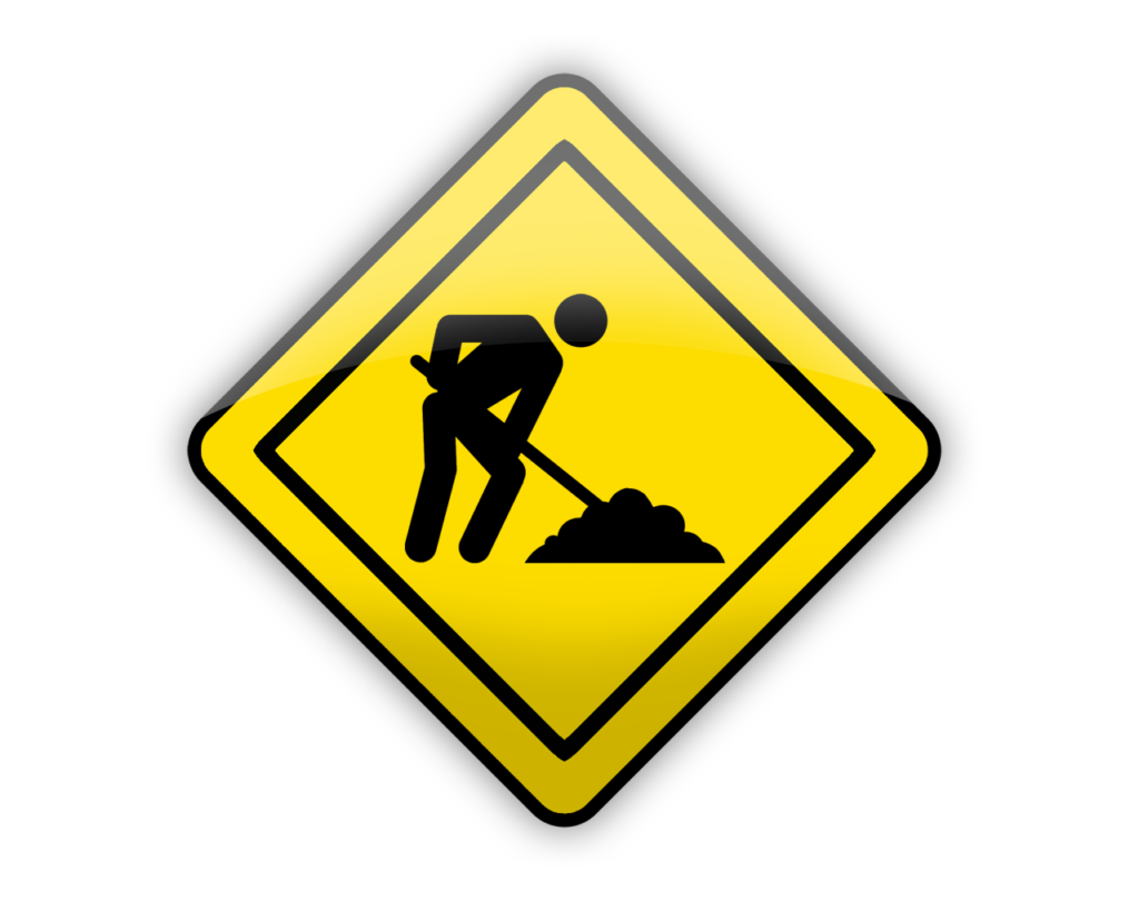 A yellow sign with a man digging in the dirt.