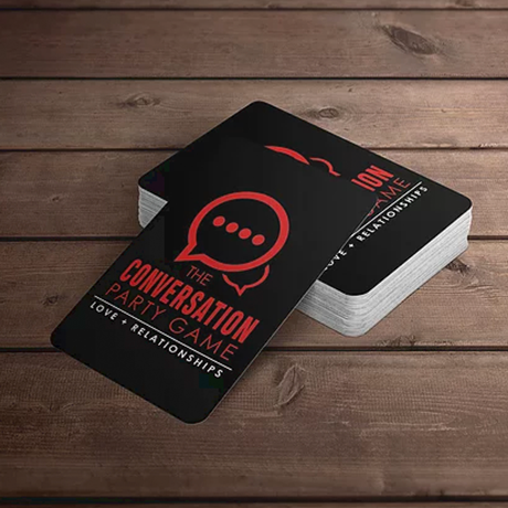 A black business card with a red logo on it.