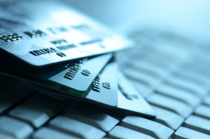 A close up of credit cards on a keyboard.