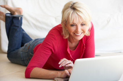 A woman using a laptop.