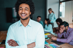 Smiling intern in meeting room