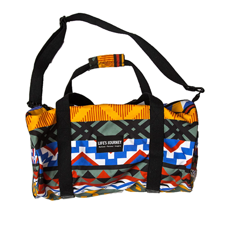 A colorful duffel bag with a geometric pattern.