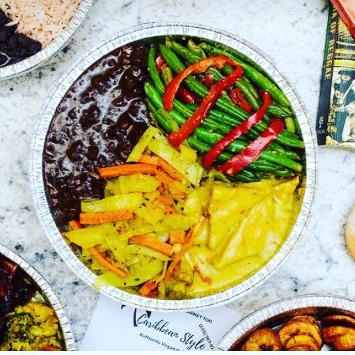 A variety of food in a bowl on a table.