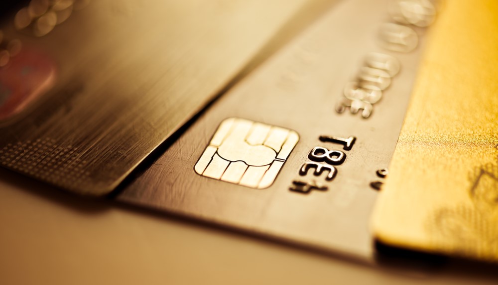 A close up of several credit cards on a table.