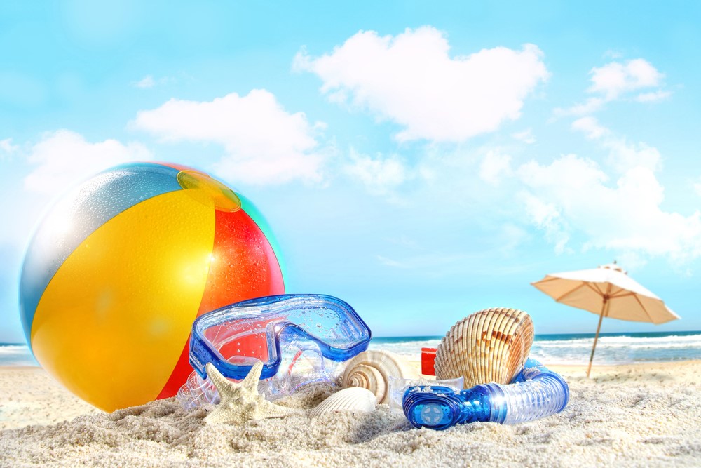 A beach scene with a beach ball and other items.