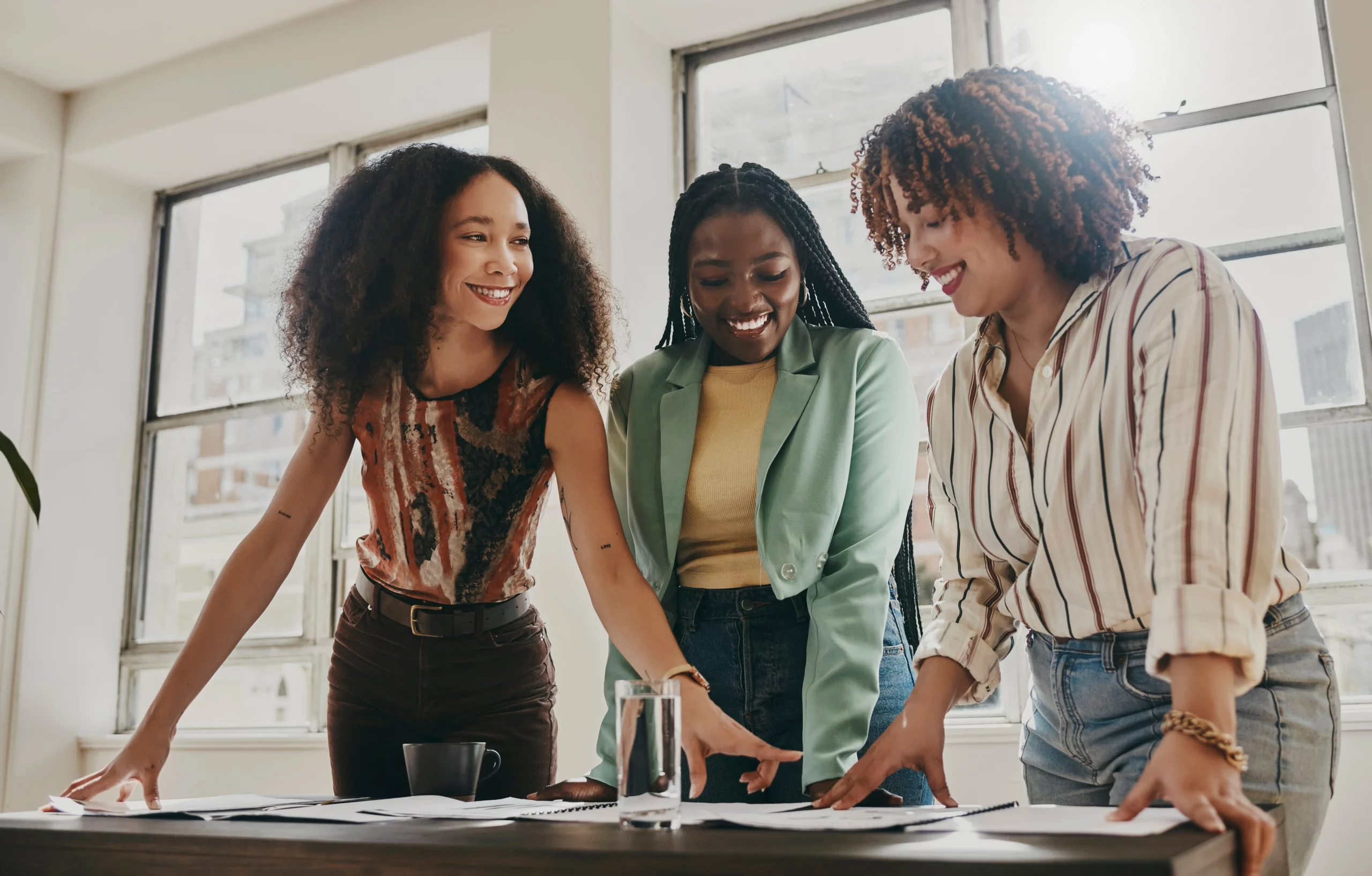 A group of women working together in an office.