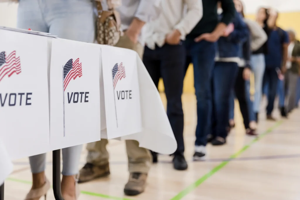 People line up to vote at a polling station.