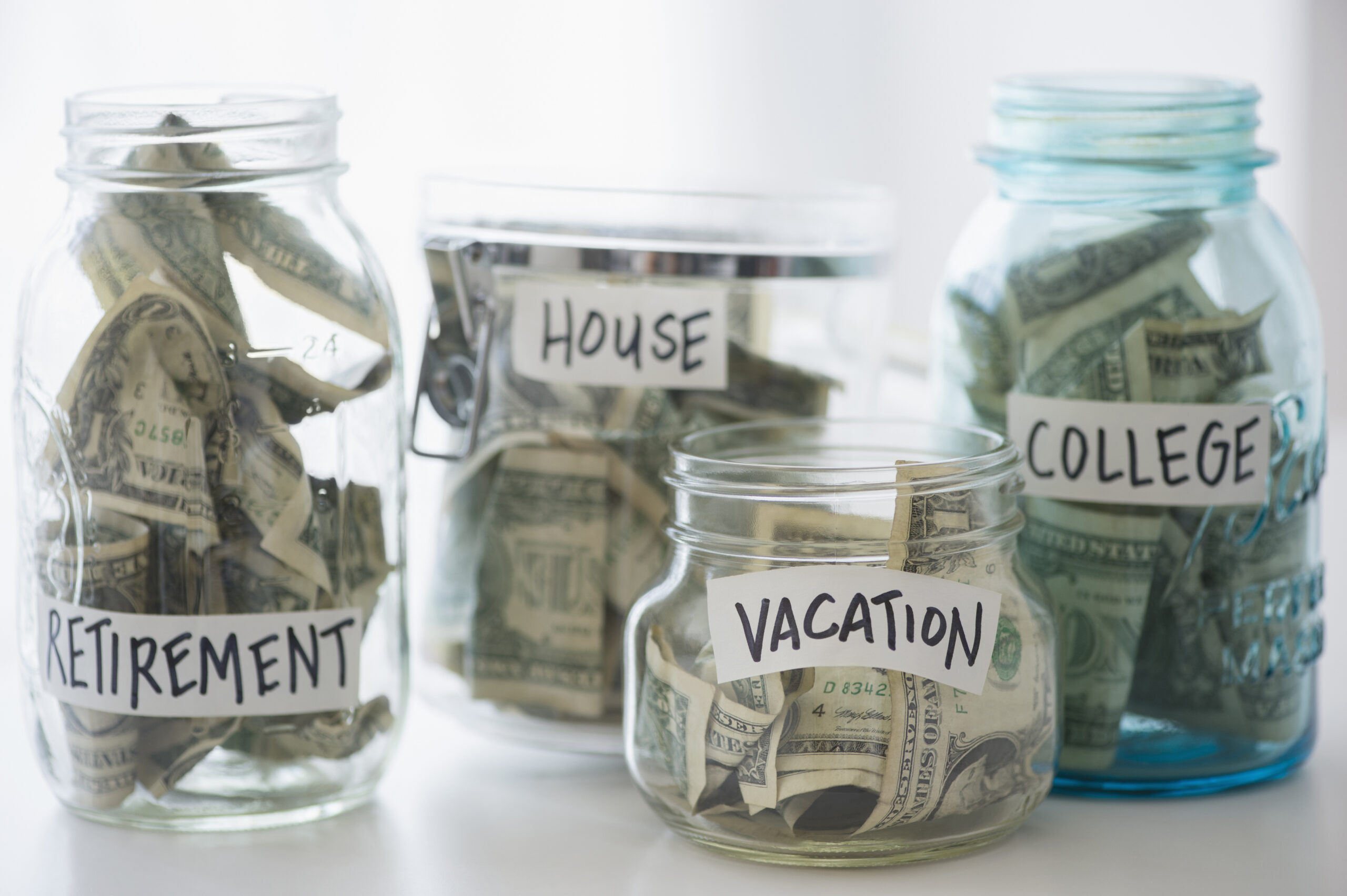 Money in jars related to BankBlack Savings