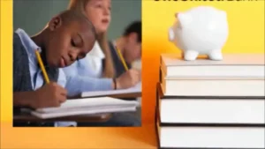 A boy is writing on a book with a piggy bank.