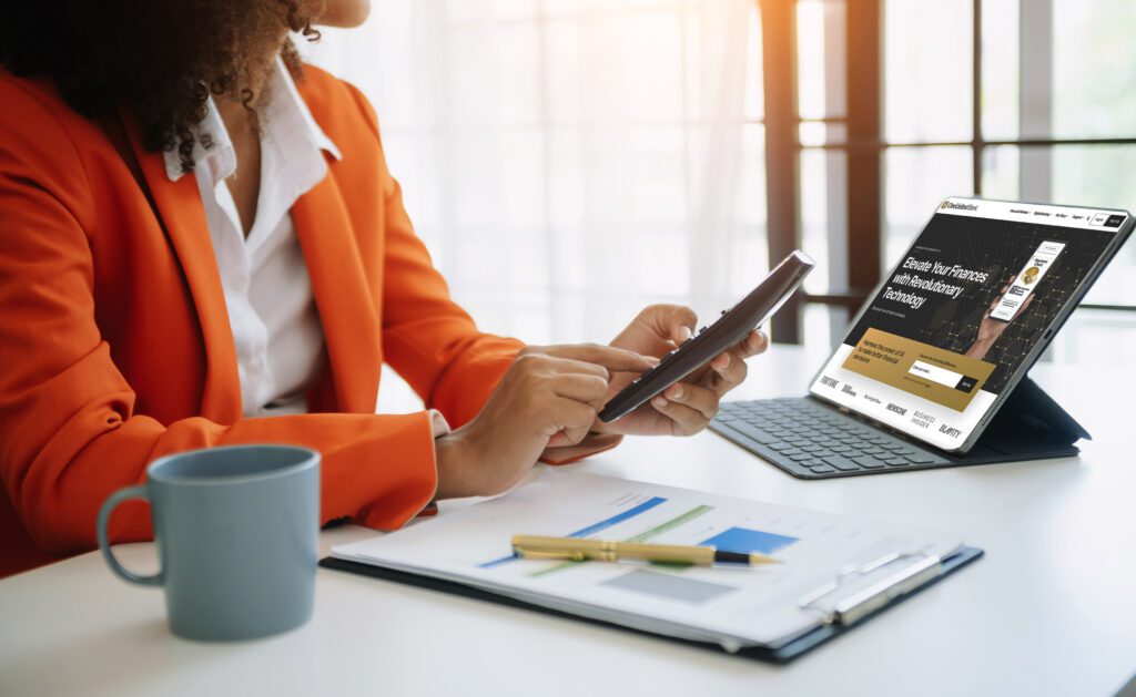 A woman is using a cell phone while sitting at a desk, managing her financial wellness.